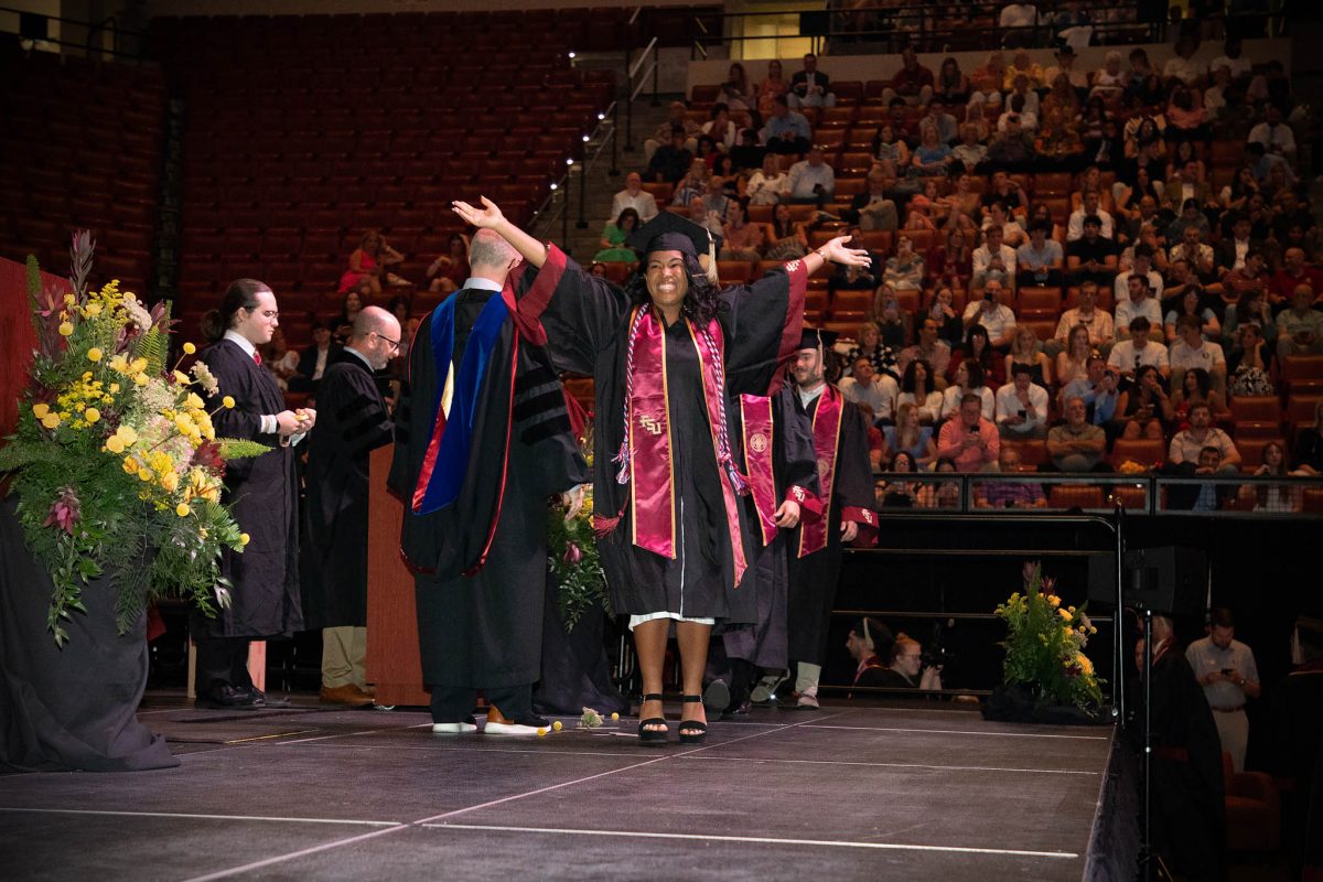 A Florida State University graduate celebrates during one of FSU's spring 2024 commencement ceremonies Friday, May 3, at the Donald L. Tucker Civic Center. (FSU Photography)