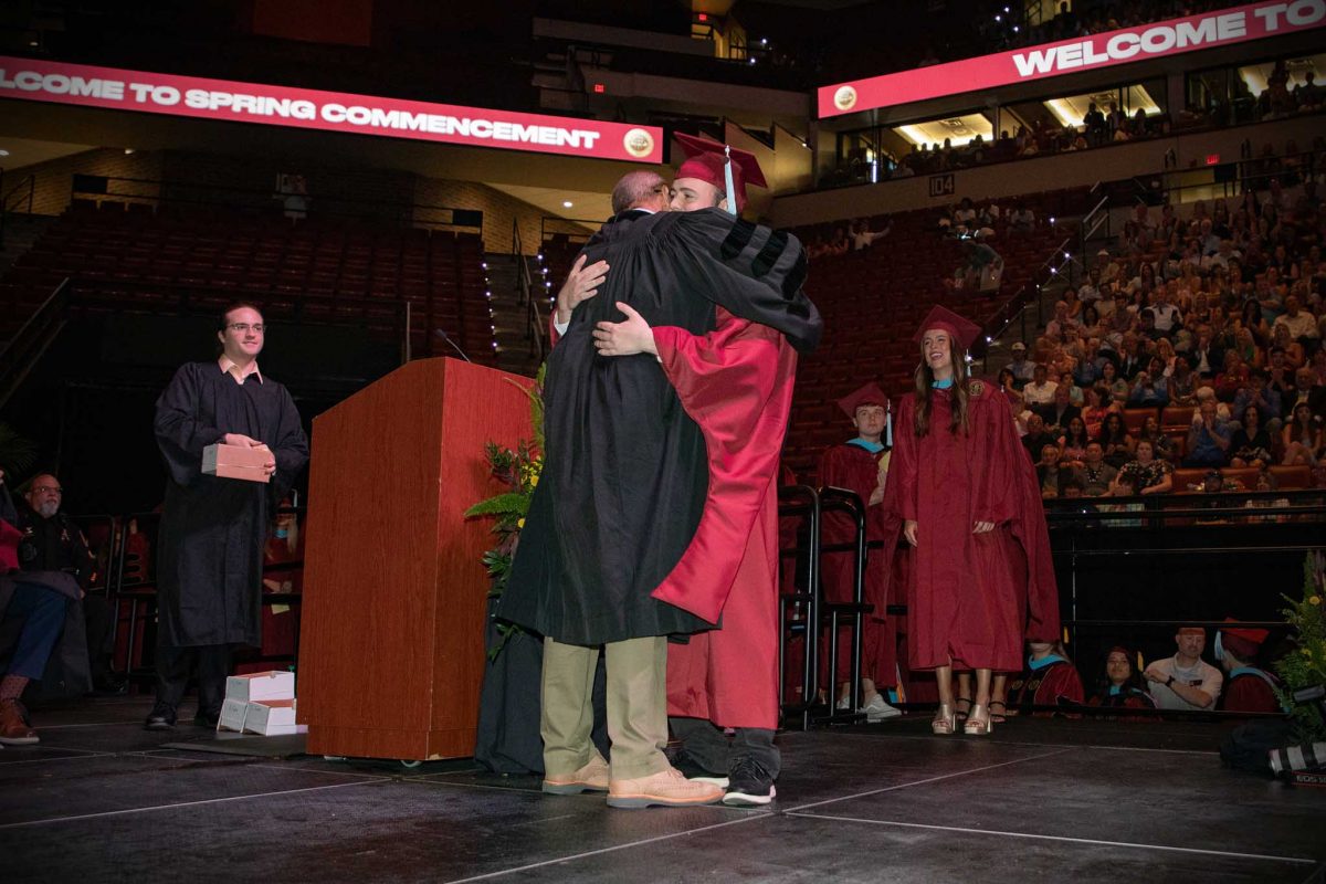 Senior Lecturer Mark Zeigler embraces his nephew, Scott Clemons, as he graduates during one of FSU's spring 2024 commencement ceremonies Saturday, May 4, 2024, at the Donald L. Tucker Civic Center. (FSU Photography)
