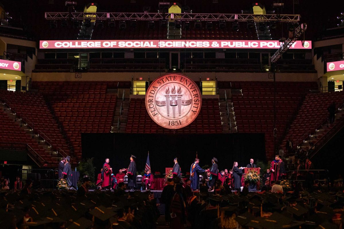 Graduates walk across the stage during one of FSU's spring 2024 commencement ceremonies Saturday, May 4, 2024, at the Donald L. Tucker Civic Center. (FSU Photography Services)