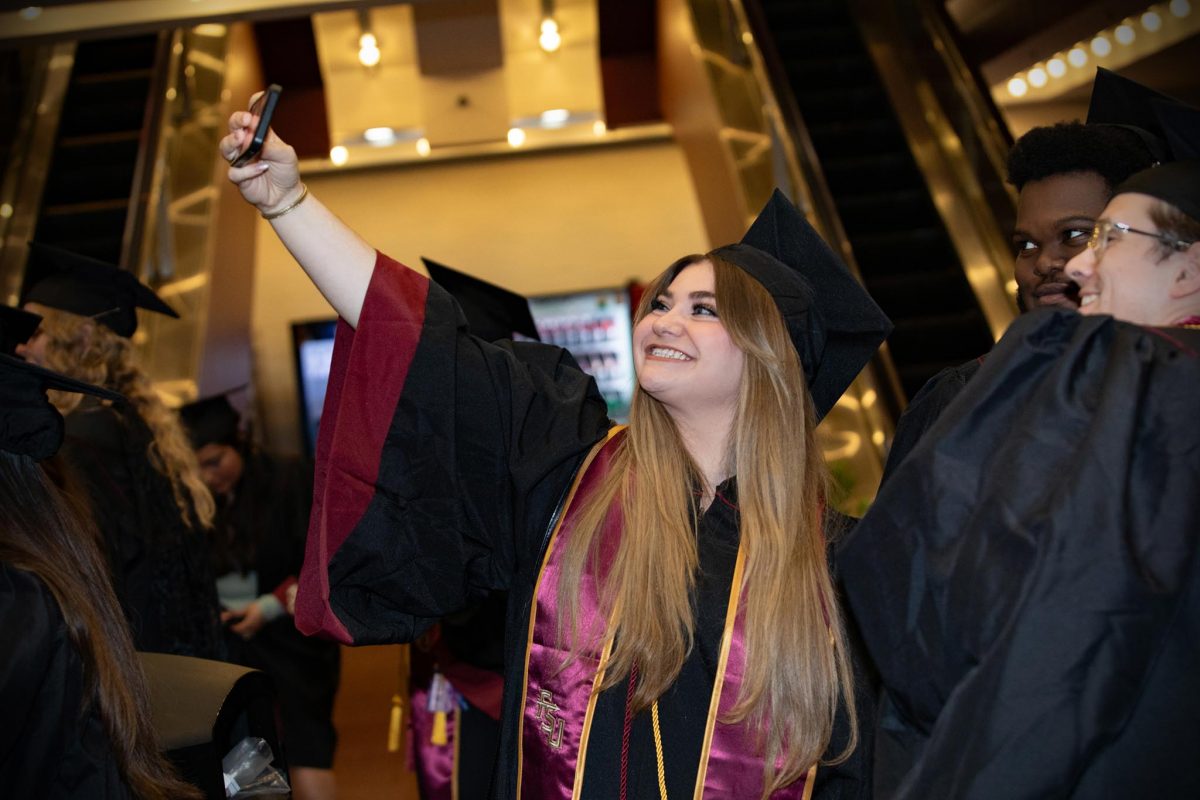 Graduates poses for a photo during one of FSU's spring 2024 commencement ceremonies Saturday, May 4, 2024, at the Donald L. Tucker Civic Center. (FSU Photography Services)