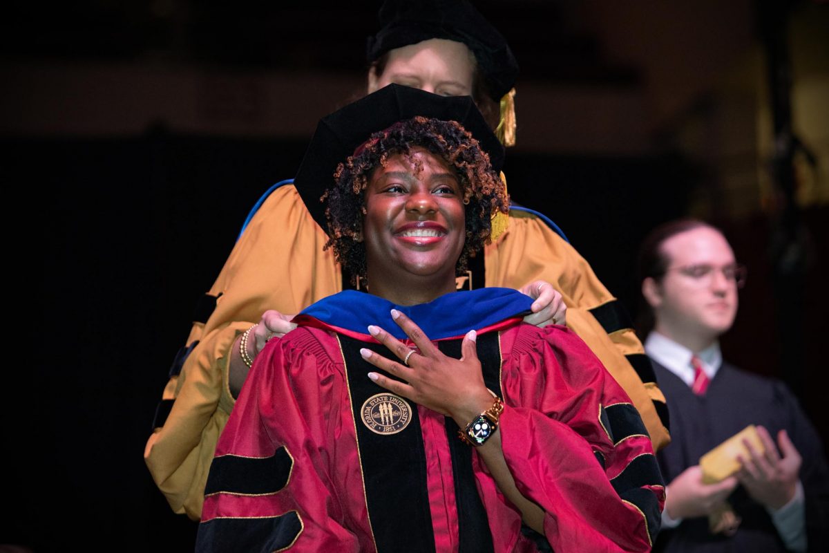 A Florida State University doctoral graduate receives their hood during the spring doctoral hooding ceremony Friday, May 3, 2024, at the Donald L. Tucker Civic Center. (FSU Photography)