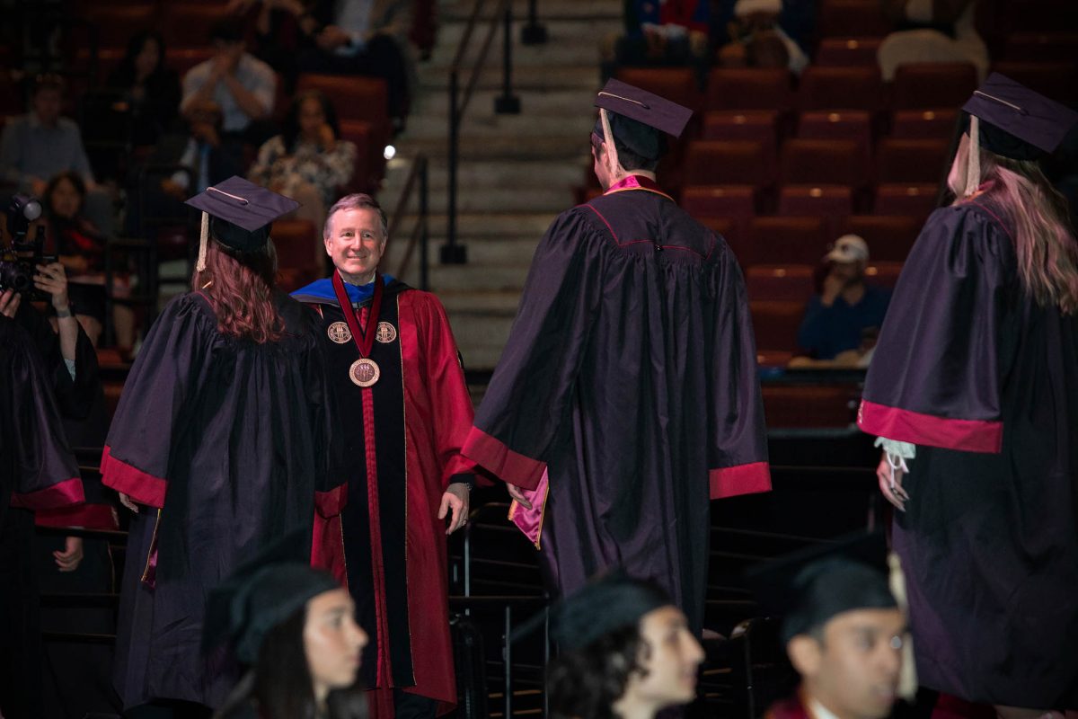 FSU President Richard McCullough and a graduate on stage during one of FSU's 2024 commencement ceremonies. (FSU Photography Services)