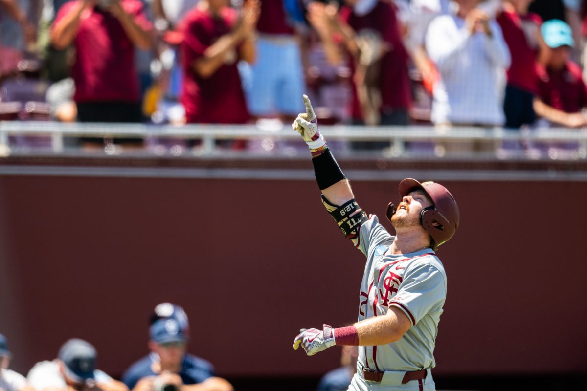 Florida State first basemen James Tibbs III hits a game-winning two-run home run in extra innings to advance FSU to the College World Series on June 8, 2024. (Photo by Matthew McConnell/Florida State University)