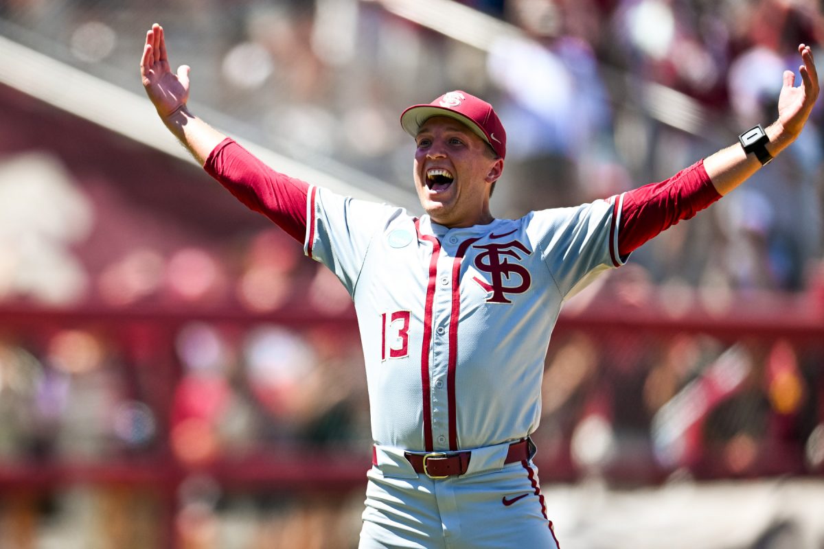 Florida State pitcher Conner Whittaker celebrates after FSU defeats UConn, 10-8, to advance to the College World Series on June 8, 2024. (Photo by Matthew McConnell/Florida State University)