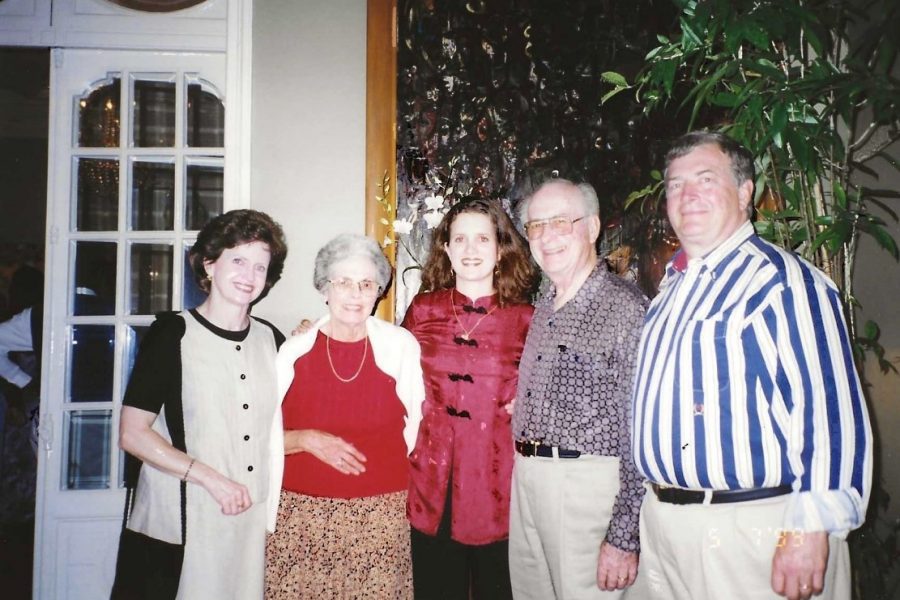 Martha Pitts (far left), Jim Pitts (far right), and their daughter, Julie Pitts (center), with a couple during the University Singers' concert tour throughout Vietnam in 1999. (International Programs)