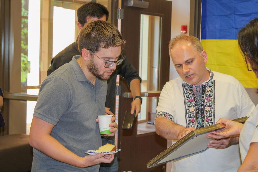 Taras Panchenko speaks with a student during International Coffee Hour at FSU. (Center for Global Engagement/Seamus Toner)