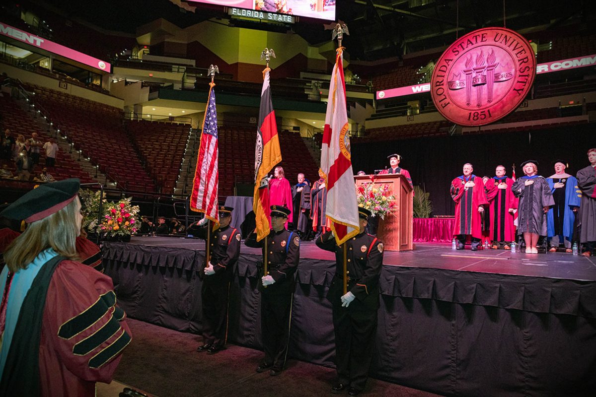 The Seminole Tribe of Florida Color Guard presents the colors at FSU's summer doctoral hooding ceremony Friday, Aug. 2, 2024. (FSU Photography)