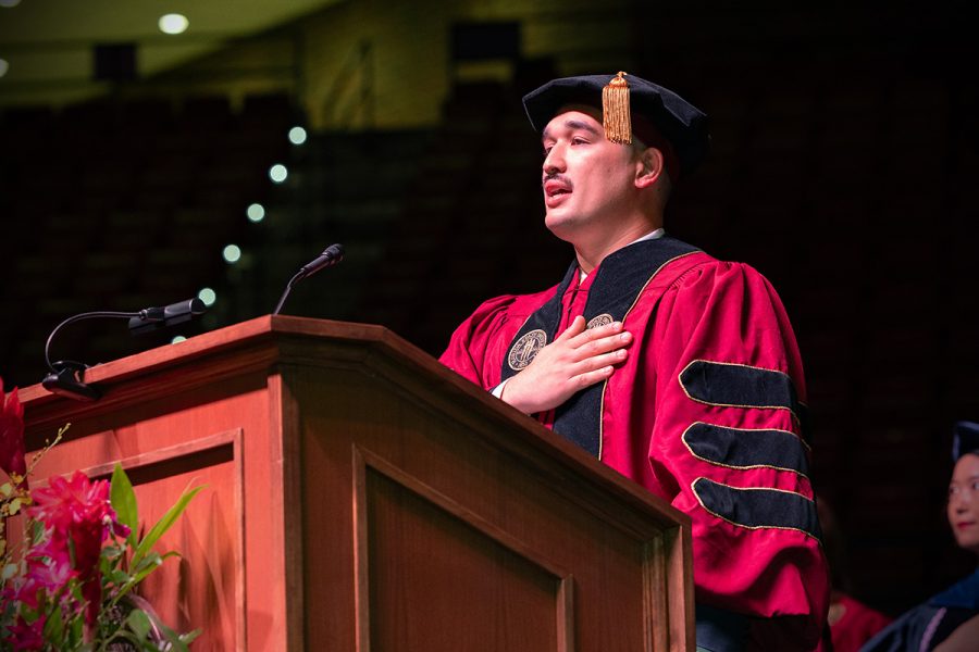 Former Florida Army National Guard Alex Fisher delivers the pledge of allegiance at the summer doctoral hooding ceremony Friday, Aug. 2, 2024, at the Donald L. Tucker Civic Center. (FSU Photography)