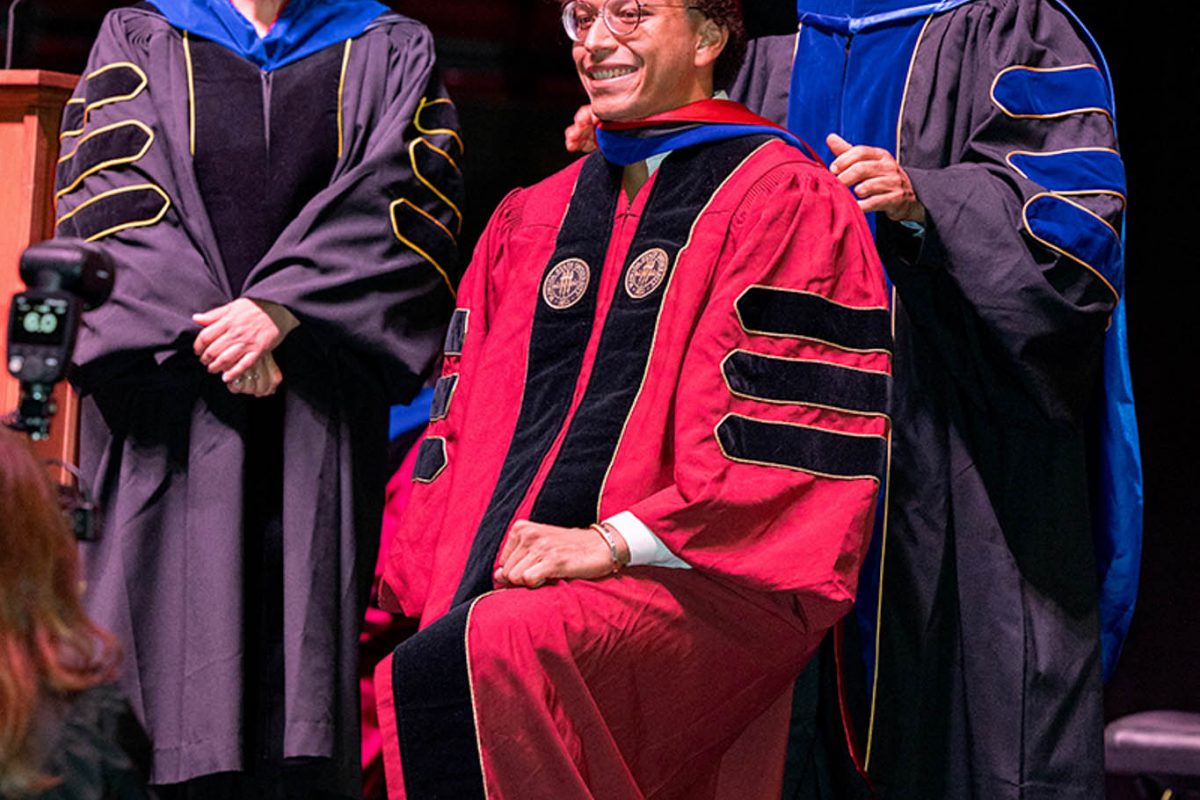 A Florida State University faculty member hoods a doctoral graduate at the summer doctoral hooding ceremony Friday, Aug. 2, 2024, at the Donald L. Tucker Civic Center. (FSU Photography)