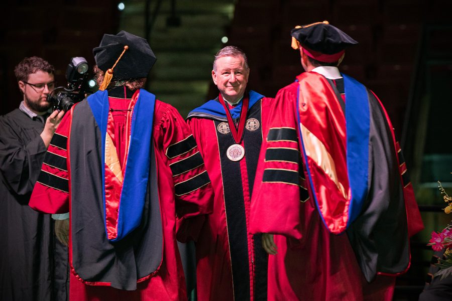 Florida State University President Richard McCullough congratulates graduates at the summer doctoral hooding ceremony Friday, Aug. 2, 2024, at the Donald L. Tucker Civic Center. (FSU Photography)