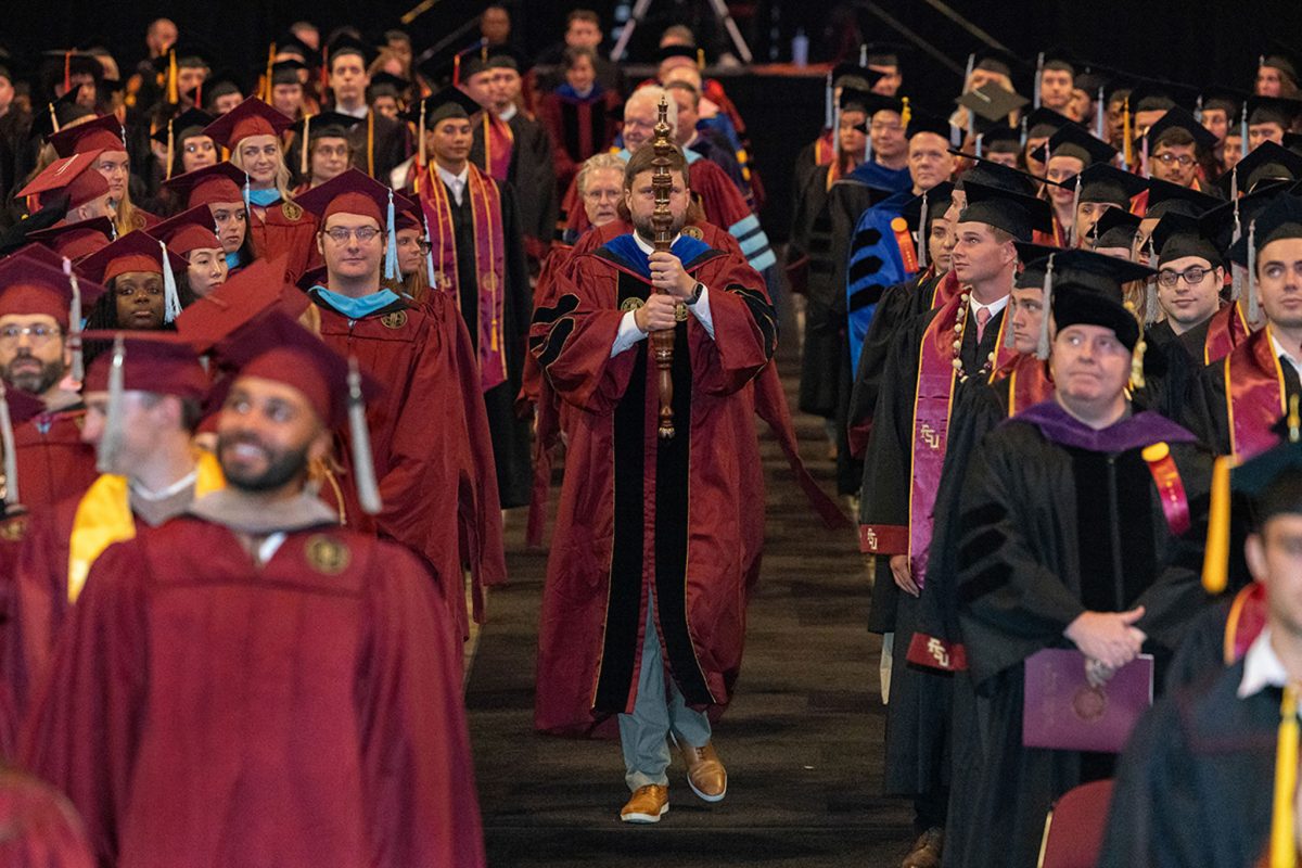 The platform party processes into one of FSU's summer 2024 commencement ceremonies Friday, Aug. 2, 2024, at the Donald L. Tucker Civic Center. (FSU Photography)