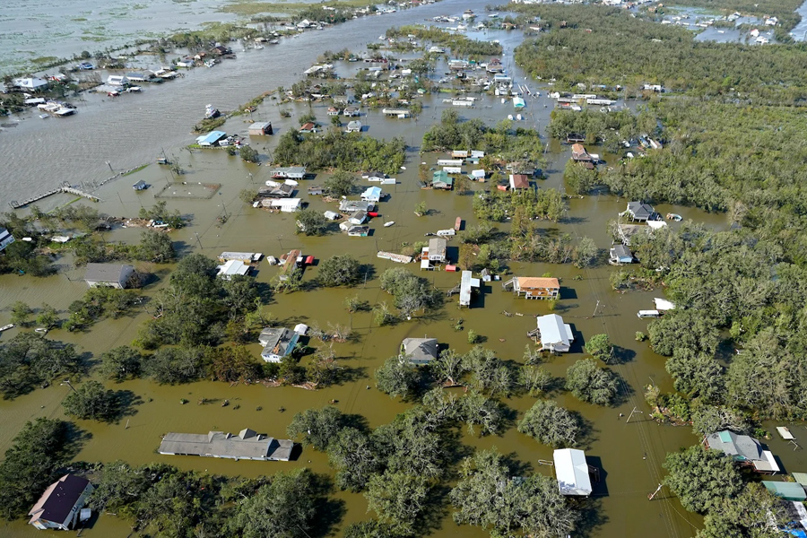 Homes are flooded in the aftermath of Hurricane Ida in August 2021 in in Lafitte, La. (Associate Press Photo/David J. Phillip)