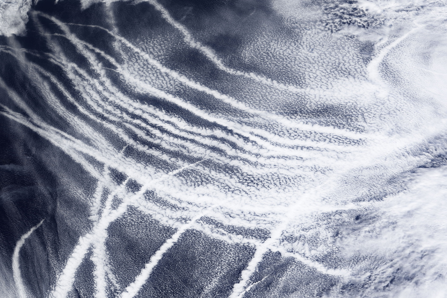 Clouds that form around the particles in ship exhaust form streaks of cloud in the northeast Pacific Ocean. (Courtesy of NASA)