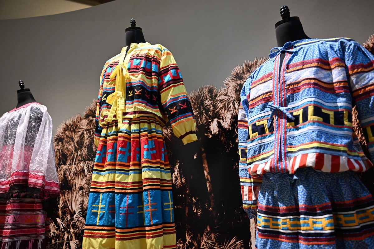 An exhibit of traditional Seminole clothing at the Ah-Tah-Thi-Ki Museum during the Seminole Tribe of Florida's annual American Indigenous Arts Celebration in early November 2024. (Aiden Briesacher)