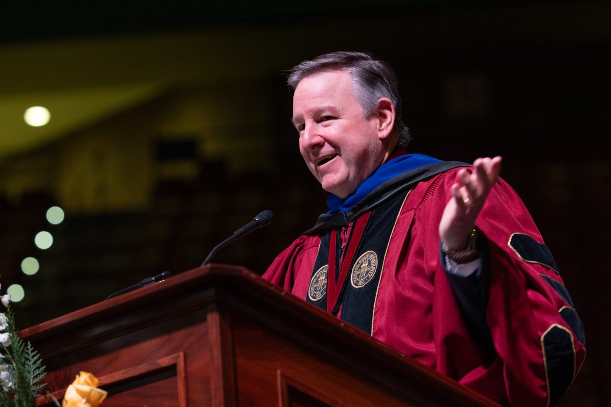 Florida State University President Richard McCullough welcomes graduates and their guests to the university’s fall doctoral hooding ceremony Friday, Dec. 13, 2024, at the Donald L. Tucker Civic Center. (FSU Photography)