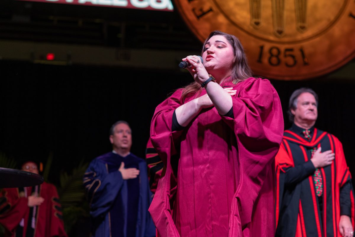 Doctoral student in vocal performance Caitlin Ecuyer sings the National Anthem at FSU's fall doctoral hooding ceremony Friday, Dec. 13, 2024. (FSU Photography)