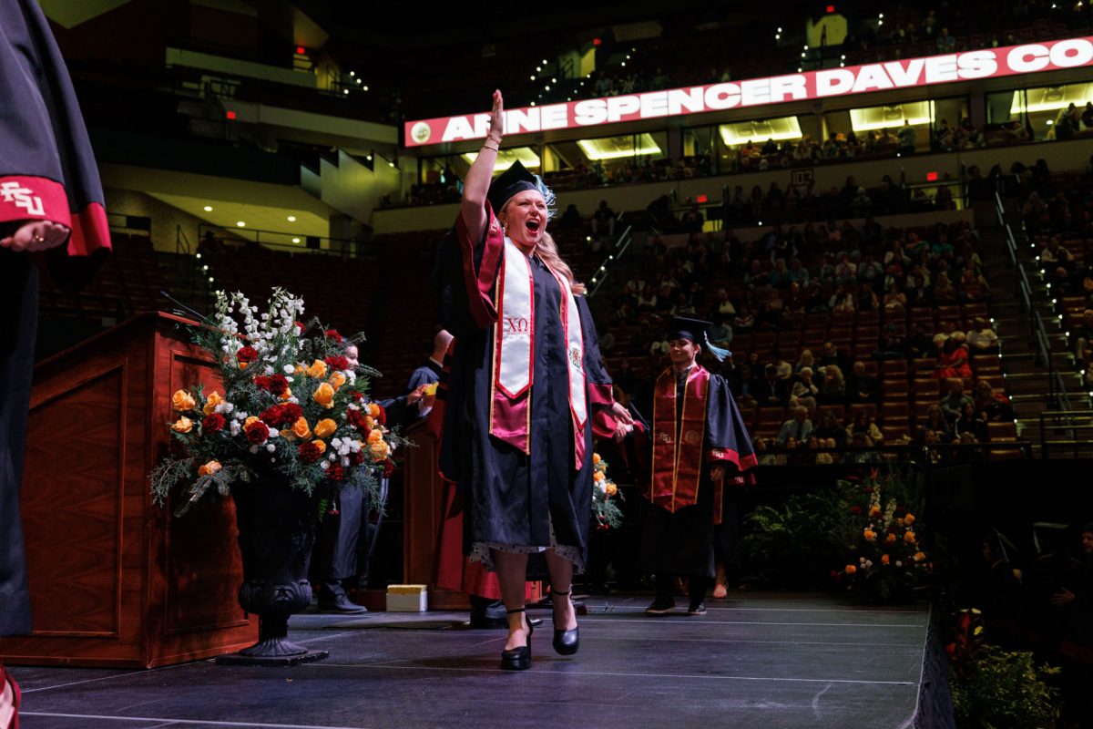 A Florida State University graduate celebrates during one of FSU's fall 2024 commencement ceremonies Friday, Dec. 13, 2024, at the Donald L. Tucker Civic Center. (FSU Photography)