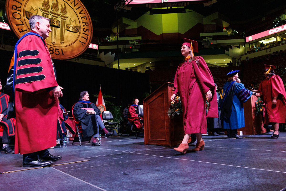 Anna Prentiss, assistant director of University Communications, received her master's in information technology at the 7 p.m. fall commencement ceremony on Friday, Dec. 13, 2024, at the Donald L. Tucker Civic Center. (FSU Photography)