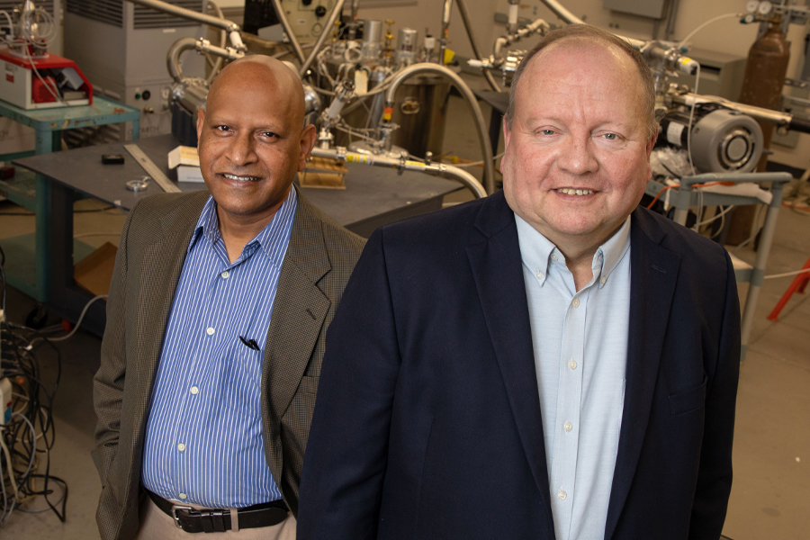 From left, Center for Advanced Power Systems Associate Director Sastry Pamidi and Director Roger McGinnis in a lab at the CAPS facility. (Bruce Palmer/FSU Photography Services)