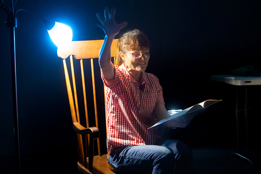 Christine Hansen, program manager for the Askew Student Life Center, reads during "Storytime Under the Stars." (Bob Howard/Challenger Learning Center of Tallahassee)