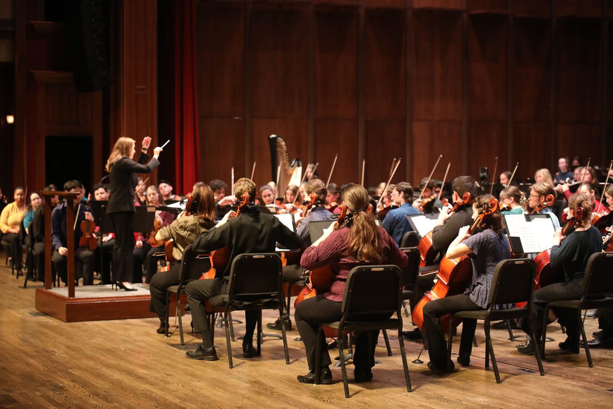 Conductor McKenna Stenson conducts to students during a musical number in the Sing with the Symphony event Feb. 1, 2025. (Josie Liederman)