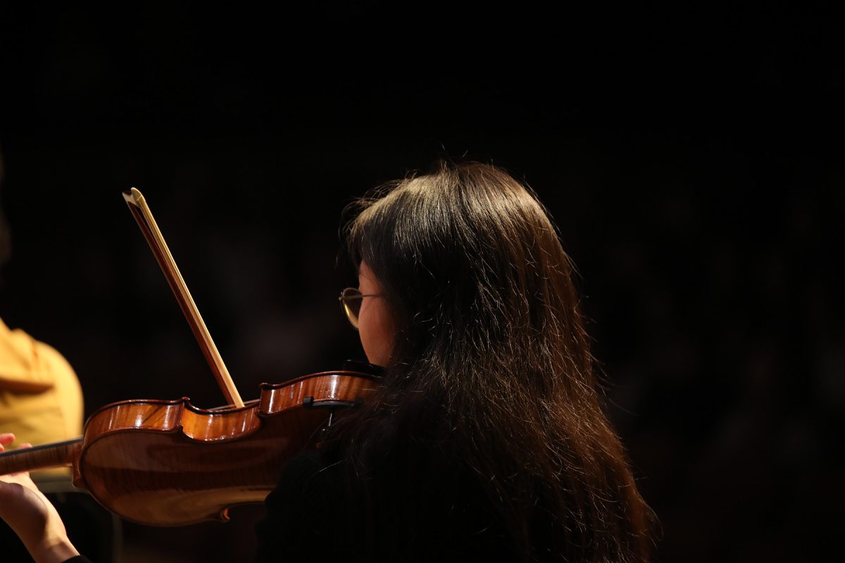 A student playing a violin during the Sing with the Symphony event at the Ruby Diamond Concert Hall Feb. 1, 2025. (Josie Liederman)