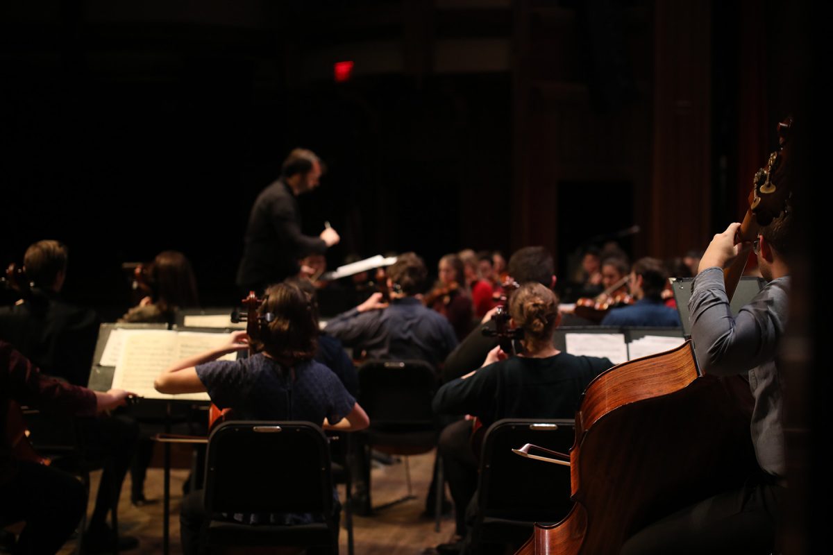 Guilherme Leal Rodrigues conducts to students during a musical number in the Sing with the Symphony Feb. 1, 2025. (Josie Liederman)