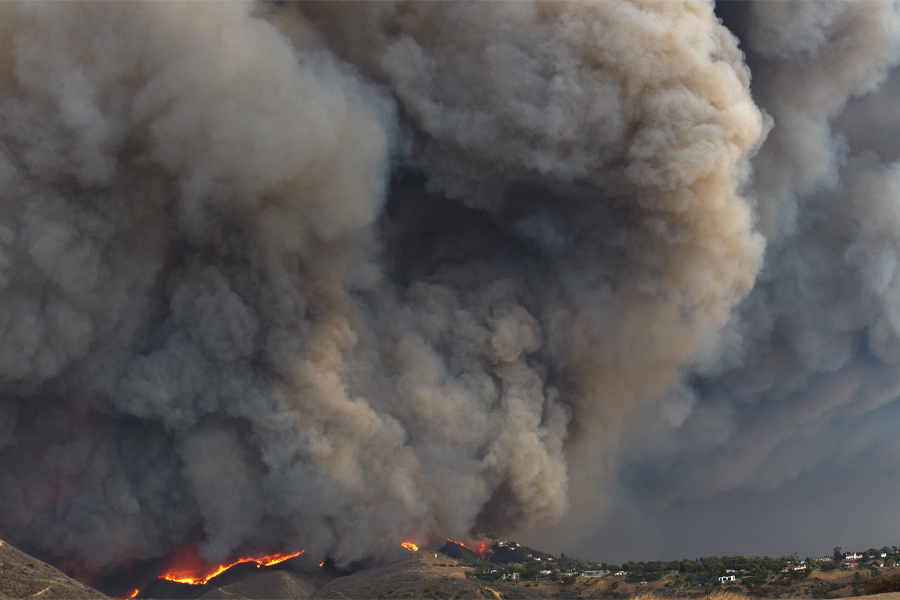 Florida State University researchers will use new funding from the National Science Foundation to investigate mechanisms that drive wildfire spread including how smoke plumes, like these seen over the Los Angeles fires in 2025, behave and interact with atmospheric stratification and topography. (Adobe Stock)