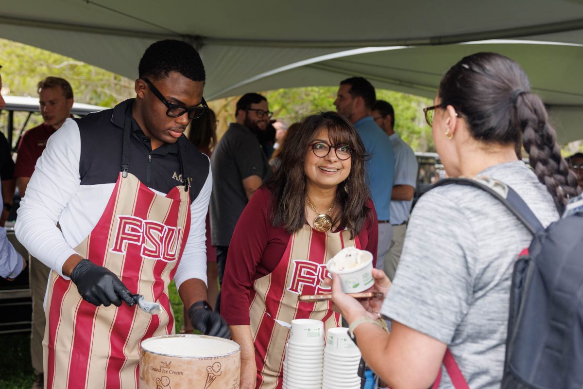 First Lady Jai Vartikar shares ice cream with students at the 2025 President's Ice Cream Social Thursday, April 3. (Florida State University)
