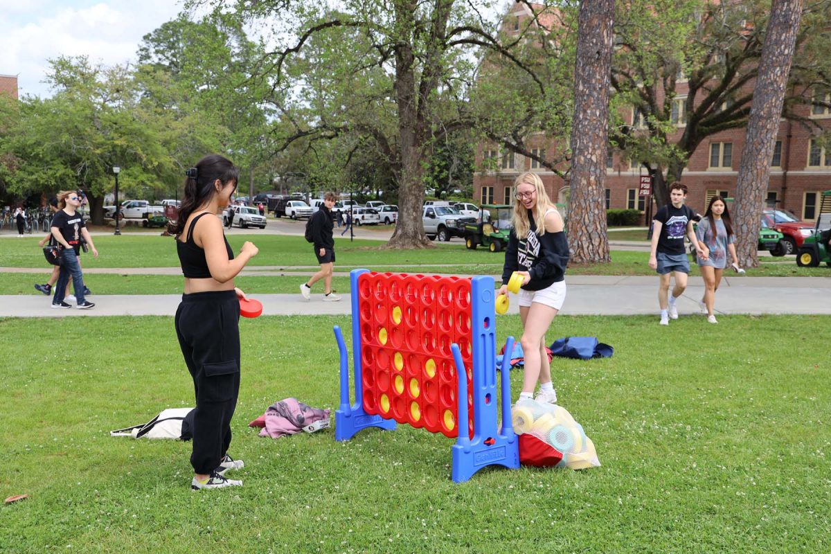 Students enjoy the 2025 President’s Ice Cream Social on Landis Green Thursday, April 3. The event was filled with outdoor entertainment and games, creating a festive atmosphere that brought smiles to everyone’s faces. (Florida State University)
