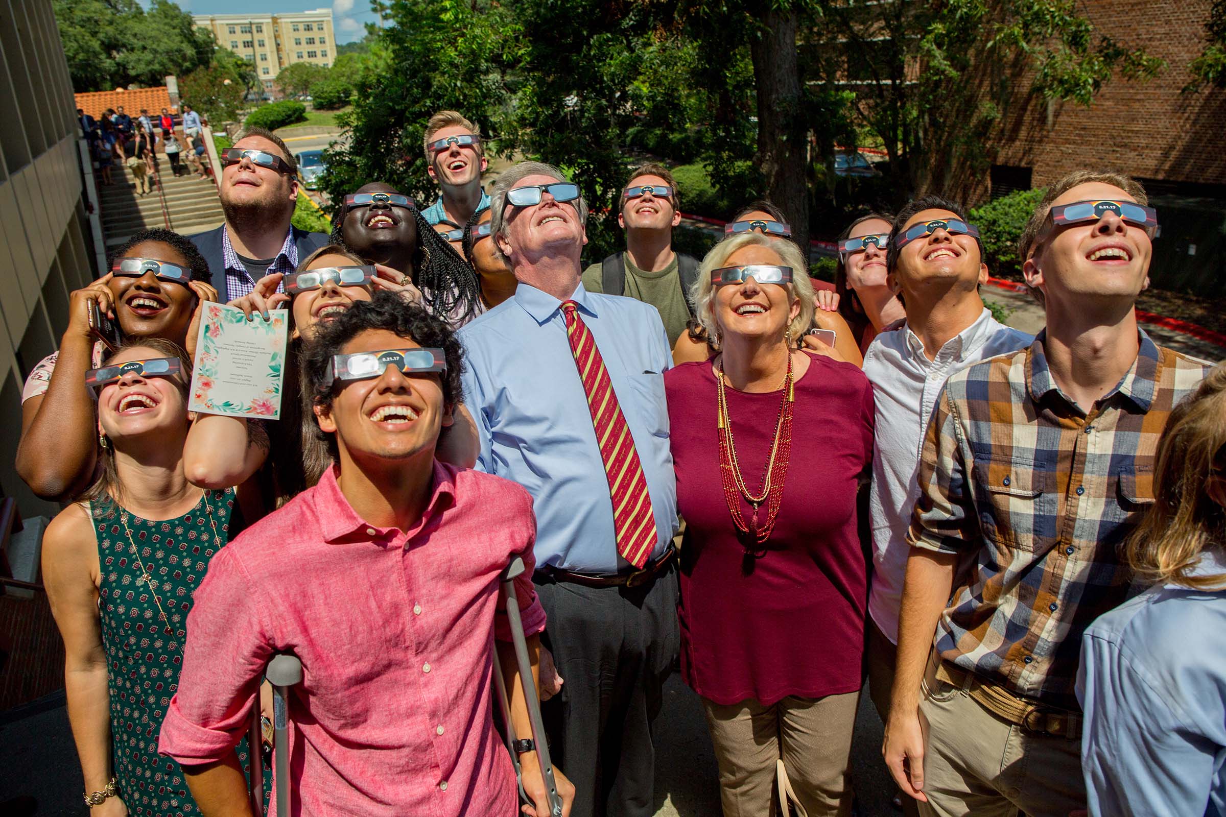 John and Jean Thrasher gather with students at the FSU Union Green to watch the solar eclipse in August 2017.
