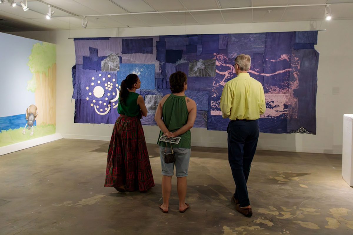 Visitors admire work by Lily Crocamo, featured in “Everything I’ve Ever Known.” (Noelle Enright/FSU College of Fine Arts)