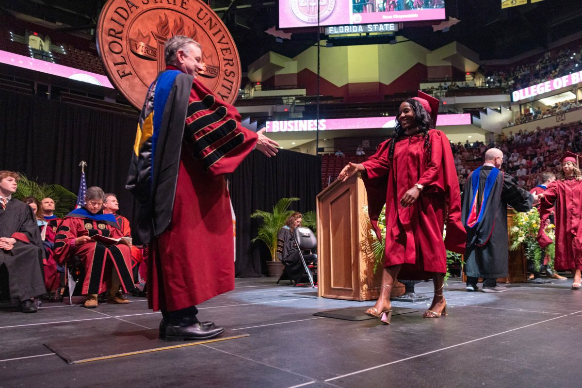 Florida State University President Richard McCullough congratulates a graduate at one of the university’s spring ceremonies Friday, May 2, 2025, at the Donald L. Tucker Civic Center. (FSU Photography)