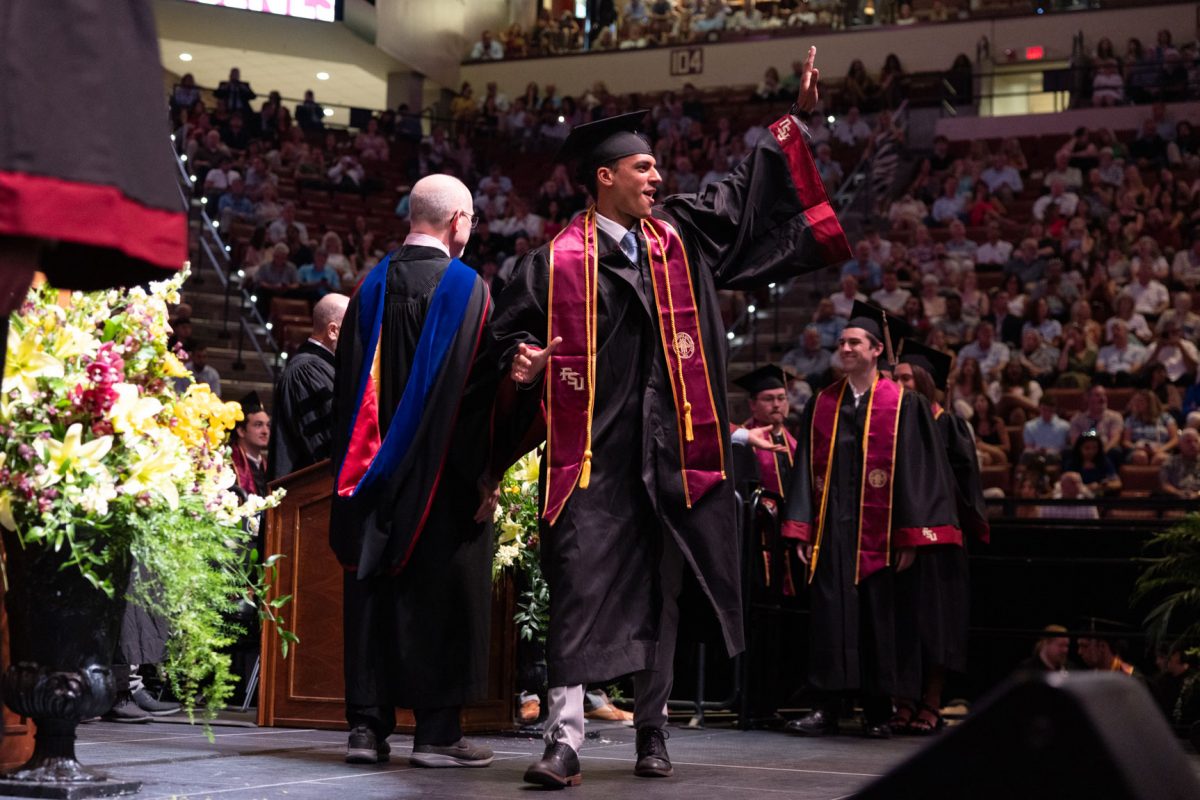 A graduate celebrates during one of Florida State University's spring ceremonies Friday, May 2, 2025, at the Donald L. Tucker Civic Center. (FSU Photography)