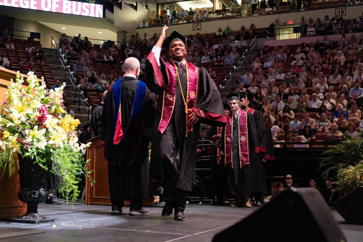 A graduate celebrates during one of Florida State University's spring ceremonies Friday, May 2, 2025, at the Donald L. Tucker Civic Center. (FSU Photography)