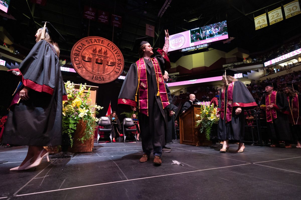 A graduate celebrates during one of Florida State University's spring ceremonies Friday, May 2, 2025, at the Donald L. Tucker Civic Center. (FSU Photography)