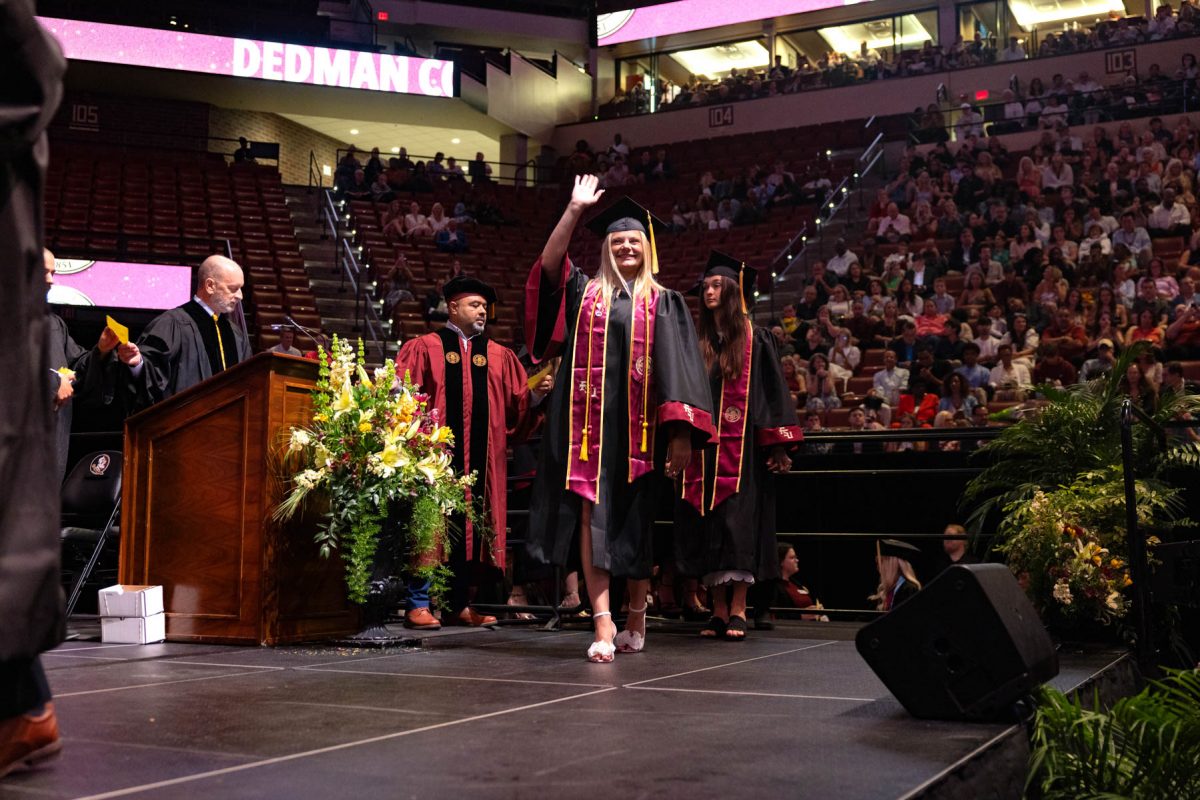 A graduate celebrates during one of Florida State University's spring ceremonies Saturday, May 3, 2025, at the Donald L. Tucker Civic Center. (FSU Photography)