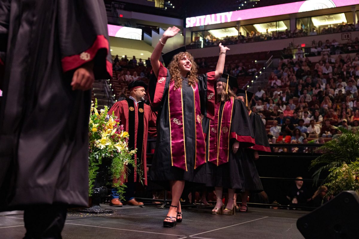A graduate celebrates during one of Florida State University's spring ceremonies Saturday, May 3, 2025, at the Donald L. Tucker Civic Center. (FSU Photography)
