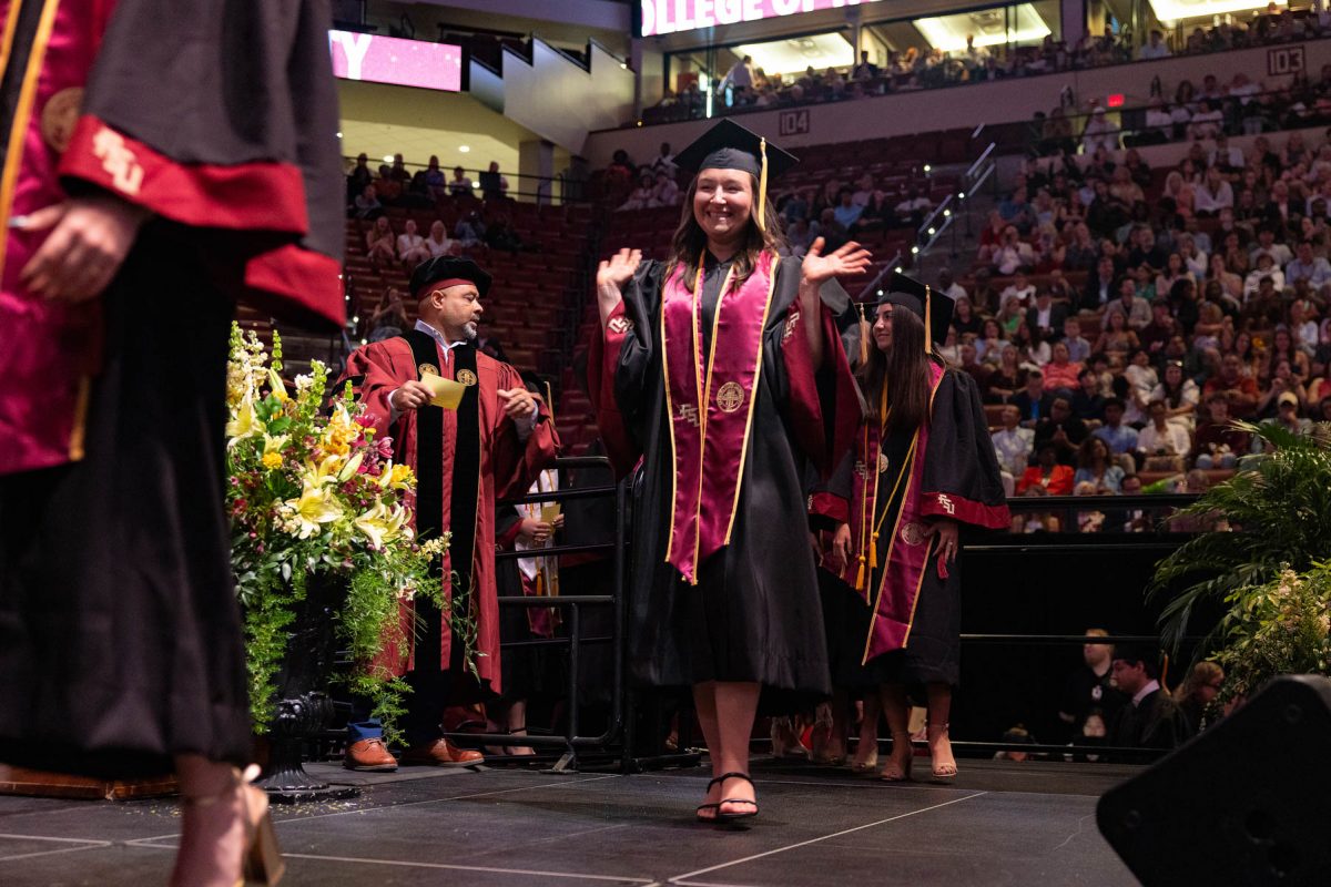 A graduate celebrates during one of Florida State University's spring ceremonies Saturday, May 3, 2025, at the Donald L. Tucker Civic Center. (FSU Photography)