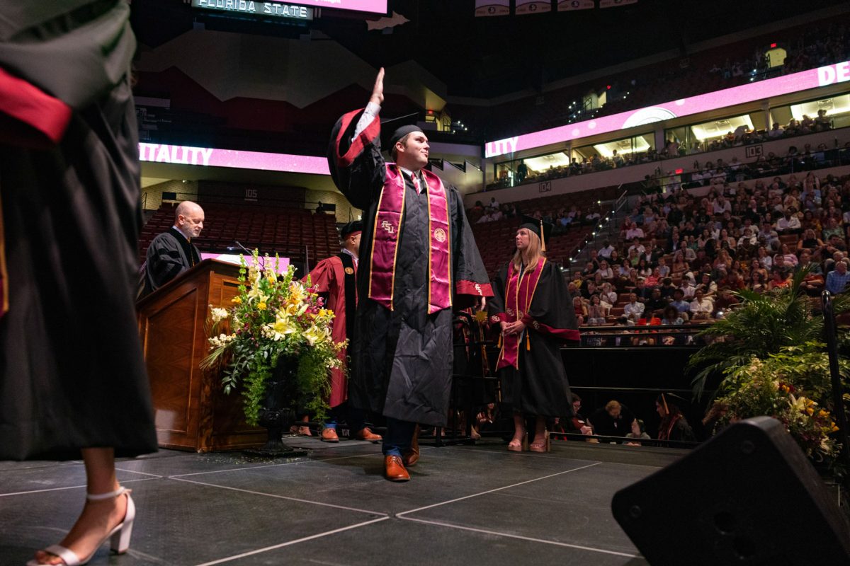 A graduate celebrates during one of Florida State University's spring ceremonies Saturday, May 3, 2025, at the Donald L. Tucker Civic Center. (FSU Photography)