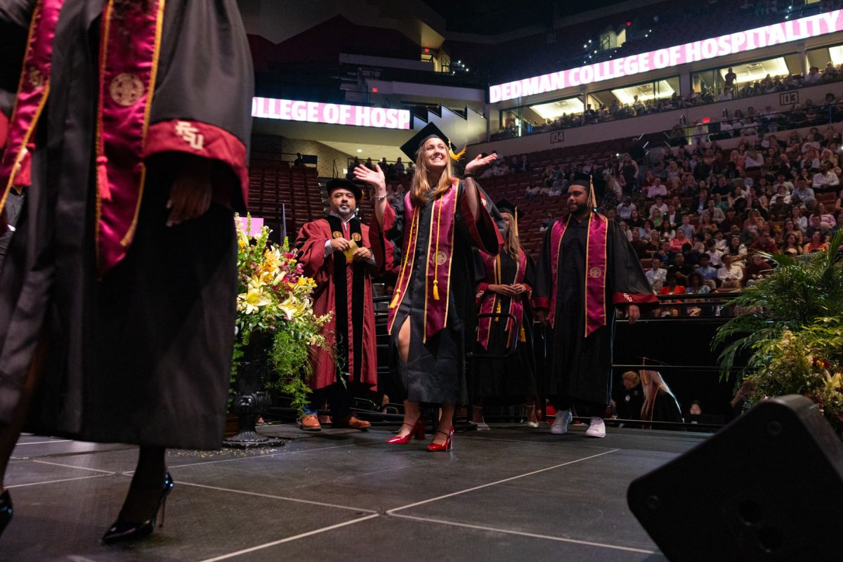 A graduate celebrates during one of Florida State University's spring ceremonies Saturday, May 3, 2025, at the Donald L. Tucker Civic Center. (FSU Photography)