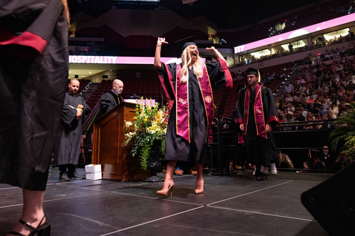 A graduate celebrates during one of Florida State University's spring ceremonies Saturday, May 3, 2025, at the Donald L. Tucker Civic Center. (FSU Photography)