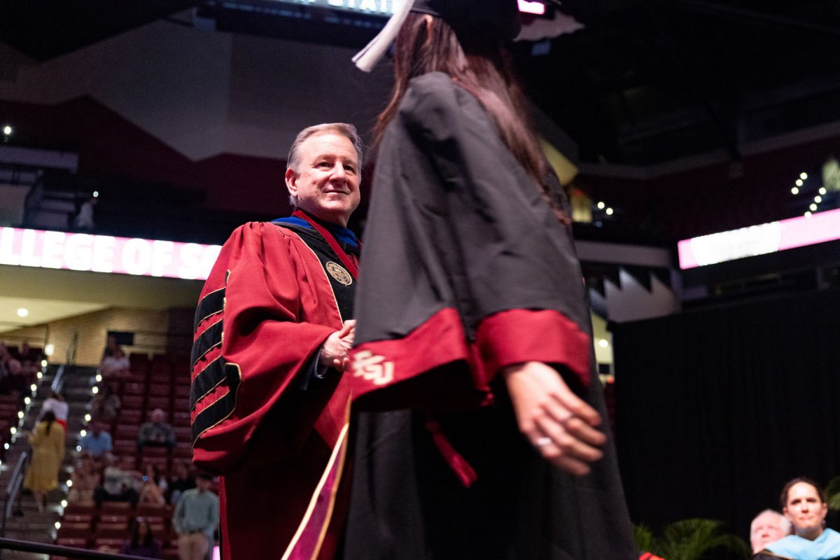 Florida State University President Richard McCullough congratulates a graduate at one of the university’s spring ceremonies Saturday, May 3, 2025, at the Donald L. Tucker Civic Center. (FSU Photography)