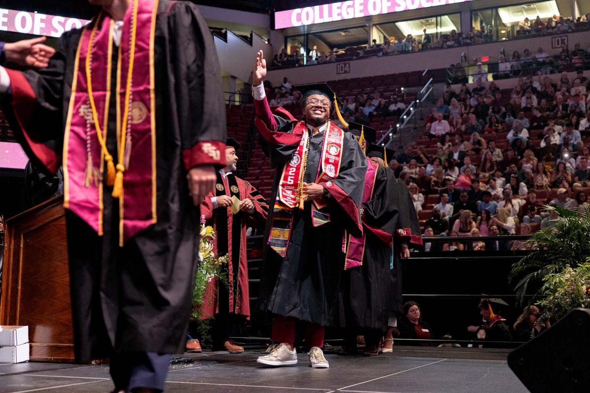 A graduate celebrates during one of Florida State University's spring ceremonies Saturday, May 3, 2025, at the Donald L. Tucker Civic Center. (FSU Photography)