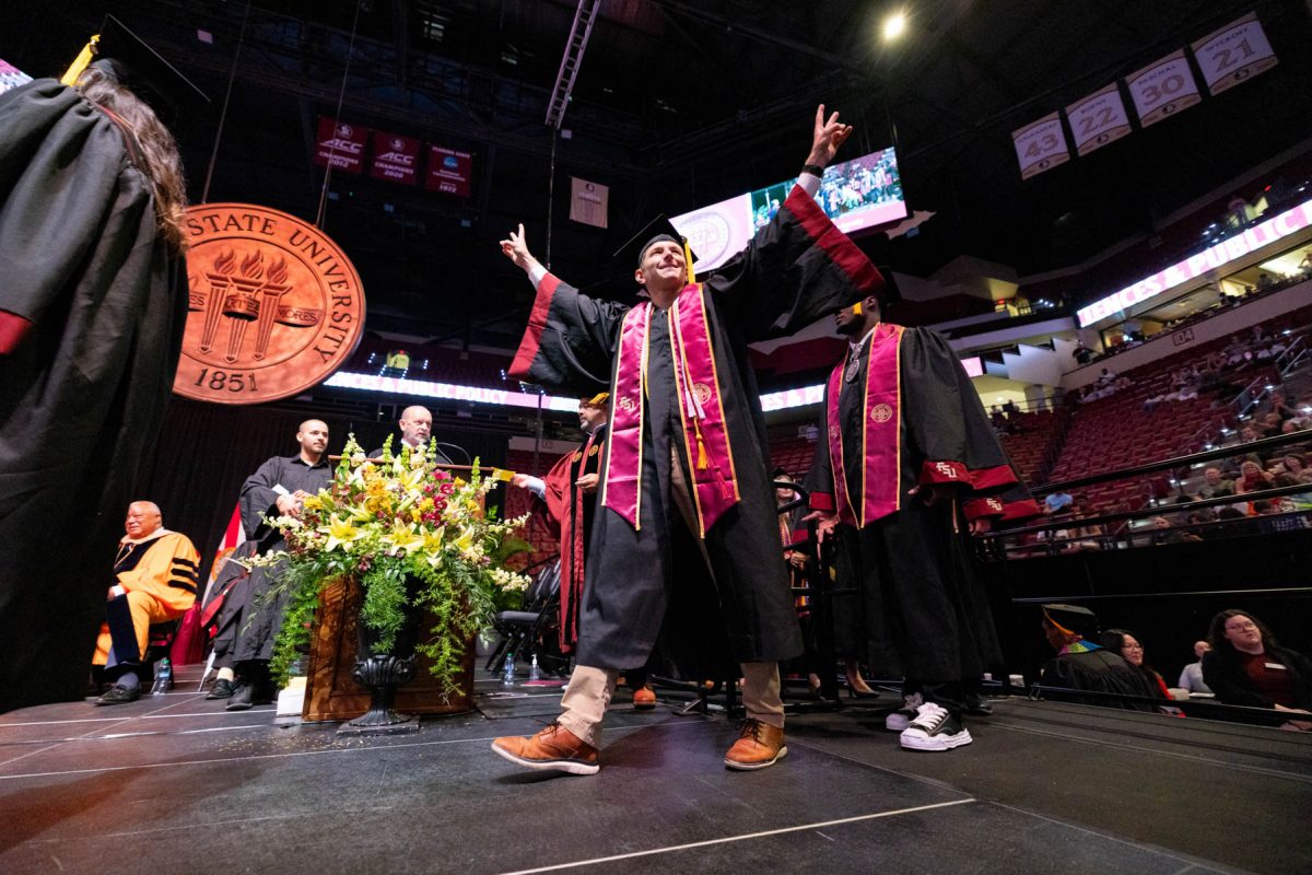 A graduate celebrates during one of Florida State University's spring ceremonies Saturday, May 3, 2025, at the Donald L. Tucker Civic Center. (FSU Photography)