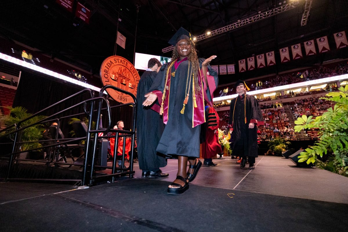 A graduate celebrates during one of Florida State University's spring ceremonies Saturday, May 3, 2025, at the Donald L. Tucker Civic Center. (FSU Photography)