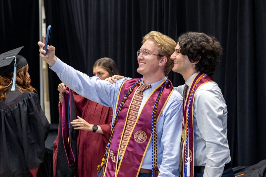 Florida State University graduates pose for selfies before one of the spring ceremonies Saturday, May 3, 2025, at the Donald L. Tucker Civic Center. (FSU Photography)