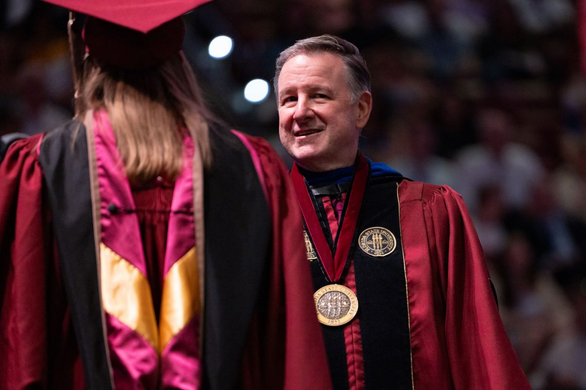 Florida State University President Richard McCullough congratulates a graduate at one of the university’s spring ceremonies Friday, May 2, 2025, at the Donald L. Tucker Civic Center. (FSU Photography)