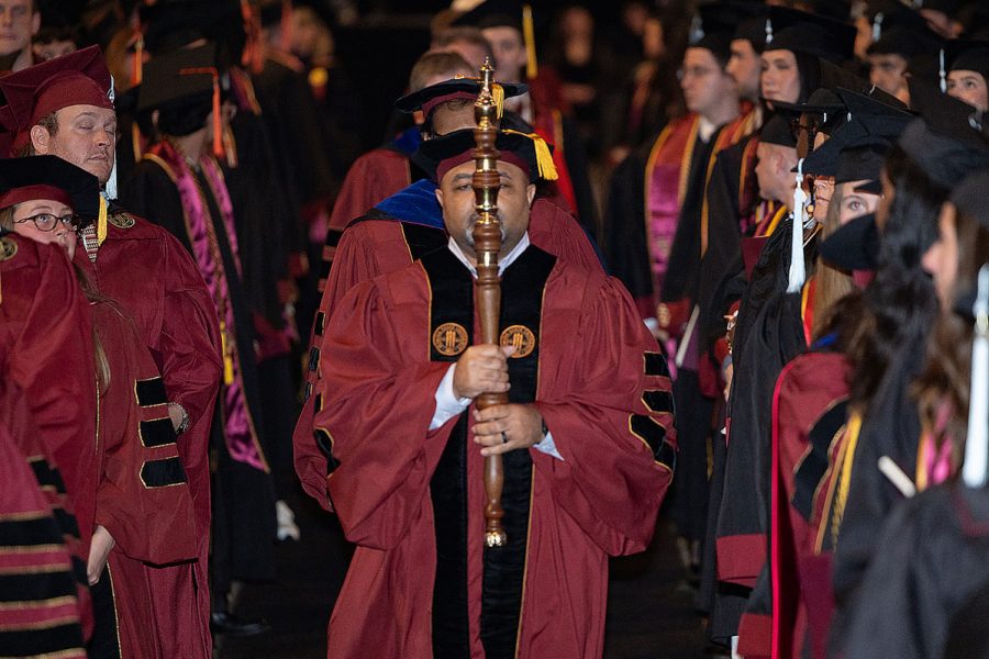 Florida State University Associate Vice President for Student Affairs Brandon Bowden carries the mace to lead the processional during spring commencement Saturday, May 3, 2025, at the Donald L. Tucker Civic Center. (FSU Photography Services)