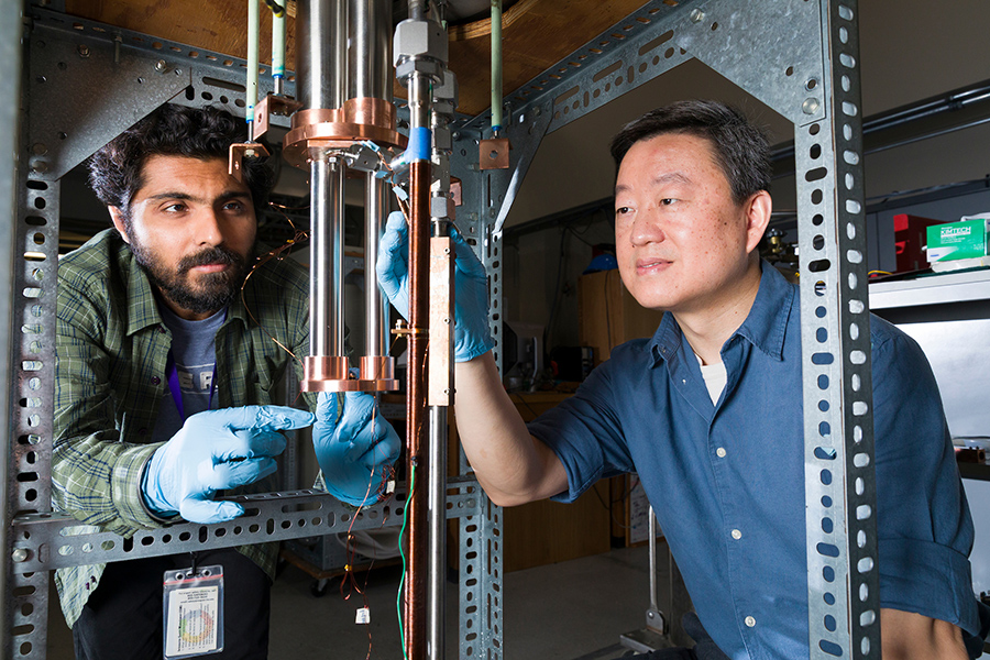 From left, graduate student Parmit Singh Virdi and Professor Wei Guo work on a custom-built test facility used to measure the heat transfer coefficients of cryogenic working fluids in the National High Magnetic Field Laboratory. The data from these experiments is crucial for designing efficient heat exchangers that will be used in liquid hydrogen-powered aircraft. (Scott Holstein/FAMU-FSU College of Engineering)